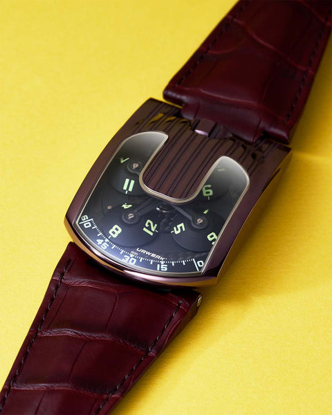 Explore the UR-103 TiAlN at UR-LEGENDS. A collector’s edition in dark TiAlN, built around URWERK’s signature satellite time display.