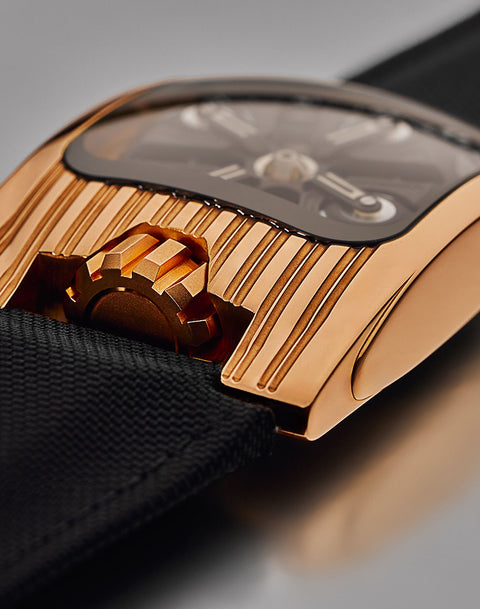 URWERK UR-103T RG featuring wandering satellite hours, open sapphire crystal, and red gold architecture. Certified pre-owned with 3 year warranty.