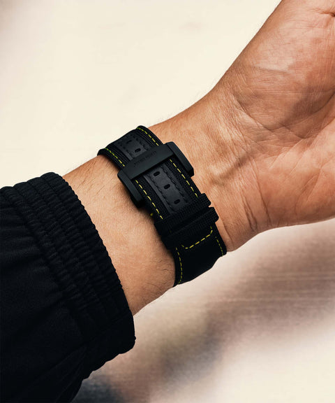 URWERK deployment clasp worn on wrist with strap.