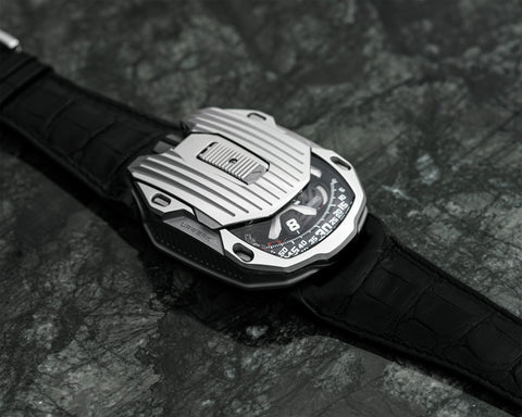 URWERK UR-105 CT Iron with hinged cover open revealing satellite time display.