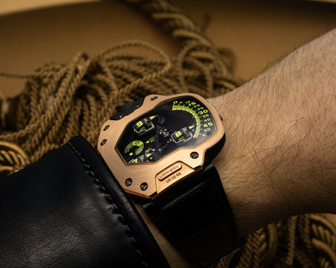 URWERK UR-110 Torpedo red gold wrist shot showing weight and presence of gold case.
