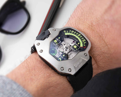 URWERK UR-110 PT platinum bezel luxury watch with small seconds, day night indicator, and oil change display.