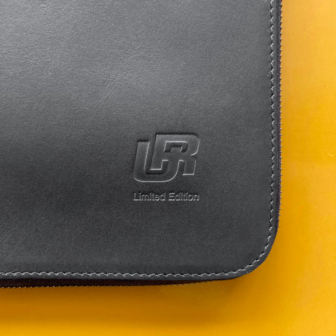 URWERK owners document holder in calf leather with embossed logo and stitched edges.
