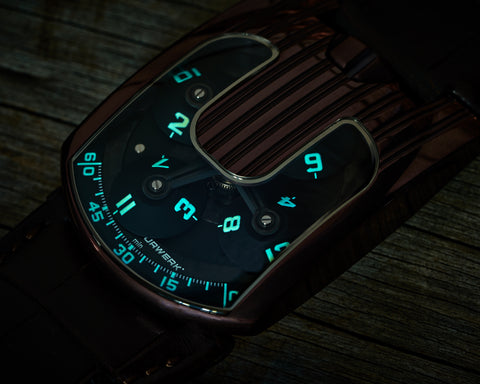 Close view of URWERK UR-103.08 TiAlN satellite carousel with orbiting hour discs, with lume.