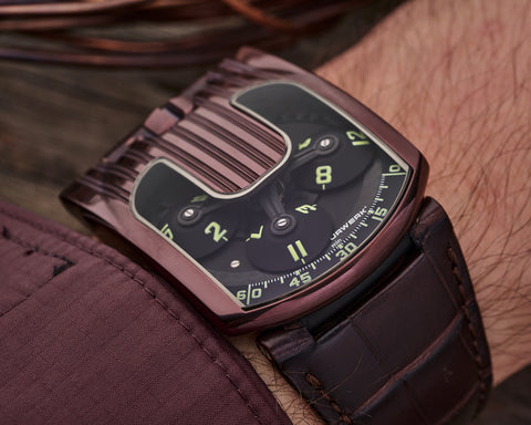 URWERK UR-103.08 TiAlN wristwatch showing satellite display and colour shifting case.
