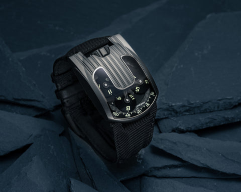URWERK UR-103.09 AlTiN black steel watch with satellite time display and matte black case.