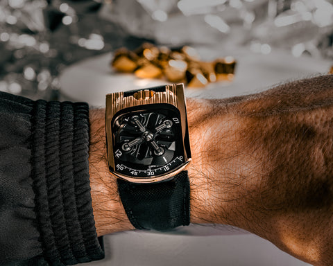 Close view of URWERK UR-103T Tarantula structure supporting rotating hour satellites.