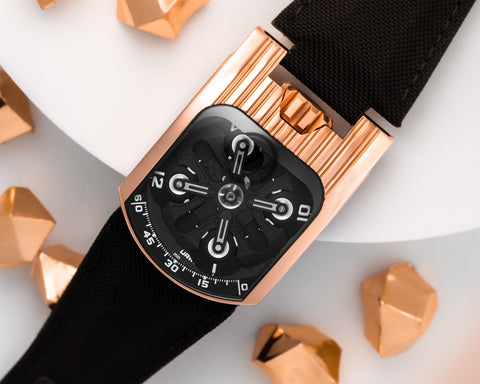 URWERK UR-103T red gold Tarantula watch with open sapphire crystal and satellite hour display.