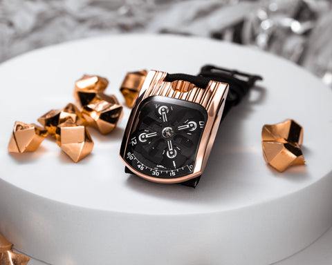 URWERK UR-103T red gold case with asymmetrical design and exposed satellite carousel.