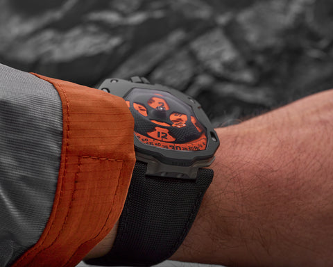 URWERK UR-105 TA Black Orange wristwatch showing architectural case and orange highlights.