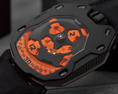 Close view of URWERK UR-105 TA satellite carousel with ARCAP construction and guilloche canopy.