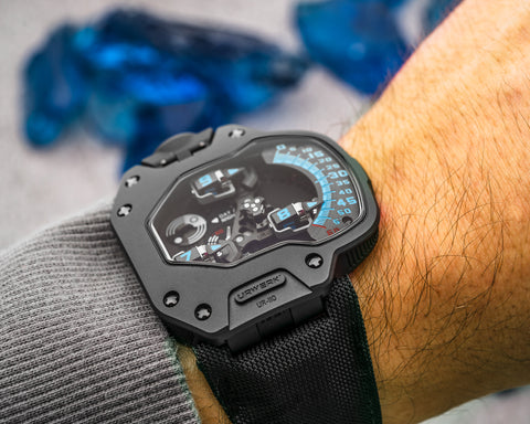 URWERK UR-110 Singapore Edition dial showing three rotating hour torpedoes with blue indexes.