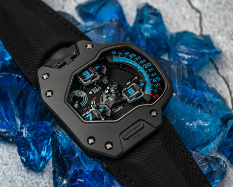 URWERK UR-110 Singapore Edition AlTiN watch with blue satellite numerals and torpedo time display.