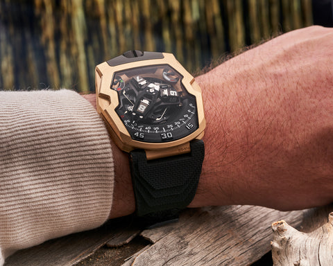 URWERK UR-210 red gold wrist shot highlighting weight and presence of gold case.