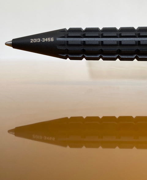 URWERK UR-PEN black rollerball pen with matte finish and engraved serial number.